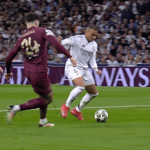 two soccer players on a field with a sign that says always