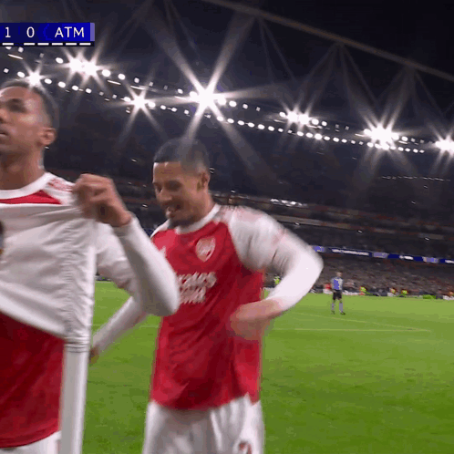 two soccer players on a field with the number 10 at the top