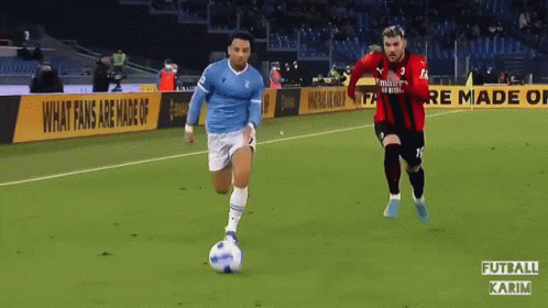 Two Soccer Players On Field With Binance Banner GIF