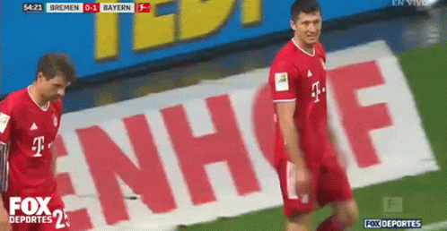 Two Soccer Players on Field with T-Mobile Ad