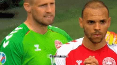 Two Soccer Players One In A Green Jersey And One In A Red Jersey GIF