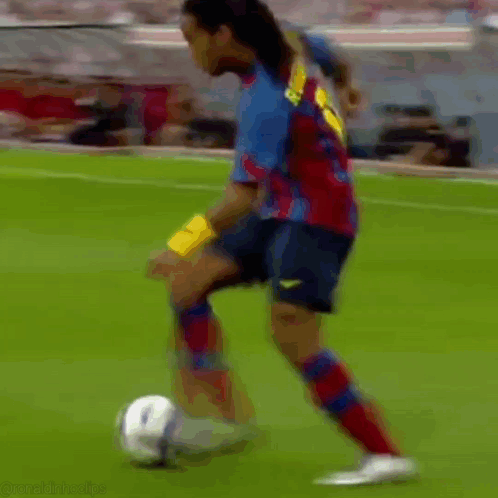 Two Soccer Players, One in Red Socks