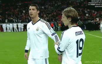 Two Soccer Players One Of Whom Has The Number 19 On Their Jersey GIF