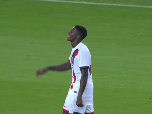 two soccer players one of whom has the number 9 on his jersey