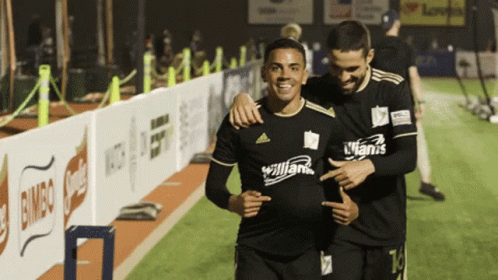 Two Soccer Players One Wearing A Jersey That Says Allianz On It GIF