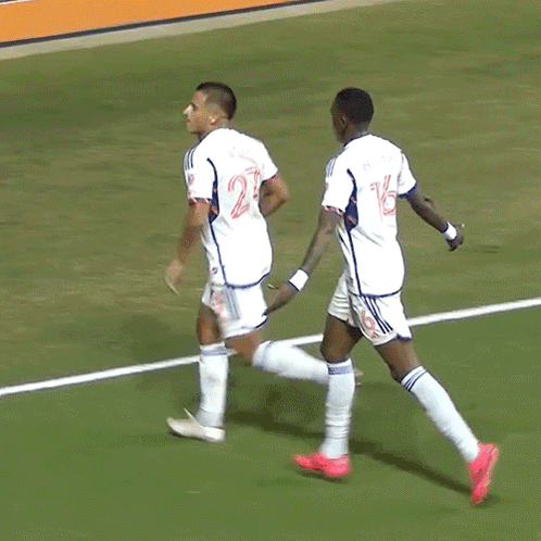 Two Soccer Players, One With Number 14