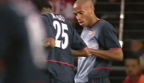 Two Soccer Players One With Number 25