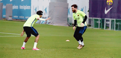 Two Soccer Players Playing Near Nike Logo