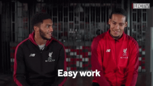 Two Soccer Players Sitting and Talking