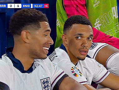 Two Soccer Players Sitting With Scoreboard Eng 92:47