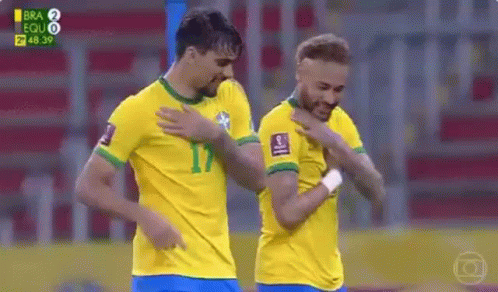 Two Soccer Players Standing Next to Each Other