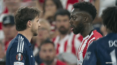 Two Soccer Players Standing On Field GIF