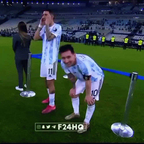 Two Soccer Players Standing on Field
