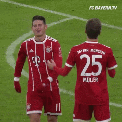 Two Soccer Players Standing Together GIF