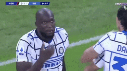 Two Soccer Players Talking on Field