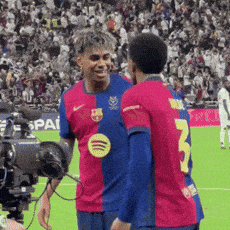 Two Soccer Players Talking on Field