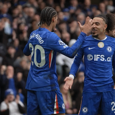 Two Soccer Players Wearing Blue Jerseys With Ifs.co On Them GIF