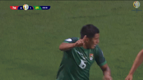two soccer players wearing marathon jerseys are running on the field