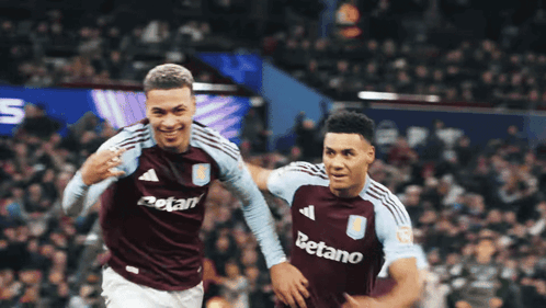 Two Soccer Players With Betano On Their Shirts GIF