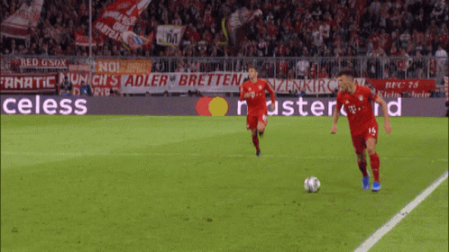 Two Soccer Players With Celess Banner