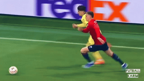 Two Soccer Players With FedEx Banner GIF