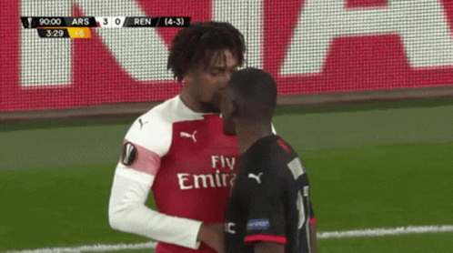 Two Soccer Players with Fly Emirates Jerseys