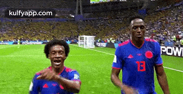 Two Soccer Players With Number 13 Jersey