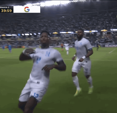 Two Soccer Players With Sign Saying Randa 2