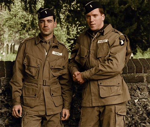 Two Soldiers Are Standing Next To Each Other And One Of Them Has A Patch On His Jacket That Says " Smith " GIF