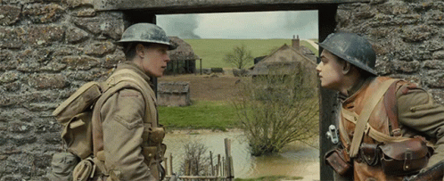 Two Soldiers Standing And Talking GIF