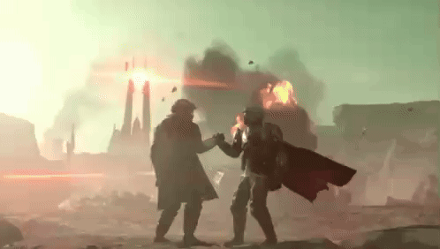 Two Soldiers Are Standing Next To Each Other In Front Of A Burning City . GIF
