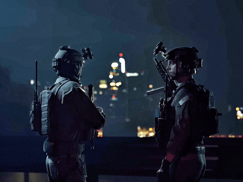 Two Soldiers Are Standing Next To Each Other With Guns In Their Hands GIF