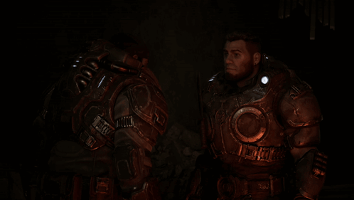 Two Soldiers In Armor Are Standing Next To Each Other In The Dark GIF