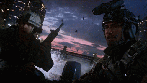 Two Soldiers Standing by Bridge at Night