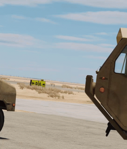 Two Soldiers Standing by Jeep