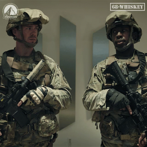 Two Soldiers Standing Next To Paramount Logo GIF