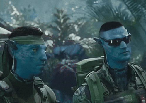Two Soldiers With Blue Faces Are Standing Next To Each Other And One Has A Backpack That Says ' Army ' On It GIF