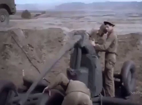 Two Soldiers Working on Cannon