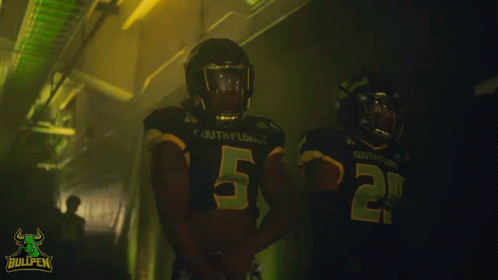 Two South Florida Football Players in Dark Locker Room