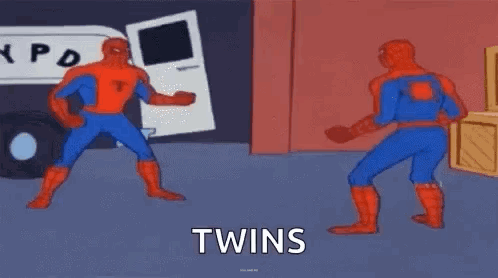 Two Spider-Man Are Standing Next To Each Other In A Room And Fighting . GIF