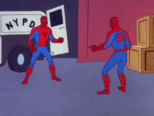 Two Spidermans Are Pointing At Each Other In Front Of A Nypd Truck . GIF