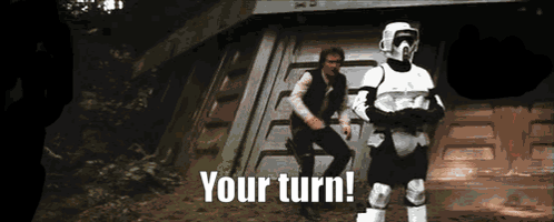 Two Stormtroopers Are Standing Next To Each Other With The Words " Your Turn " Written Below Them GIF