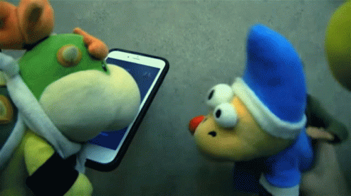 Two Stuffed Animals Are Looking At A Cellphone GIF