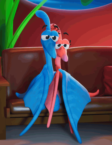 Two Stuffed Animals Are Sitting On A Couch In Front Of A Tv GIF