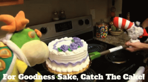 Two Stuffed Animals Are Standing Next To A Cake On A Stove With The Words " For Goodness Sake Catch The Cake " Below The GIF