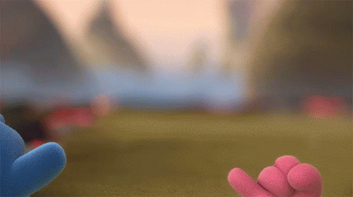 Two Stuffed Animals Are Standing Next To Each Other In A Field GIF