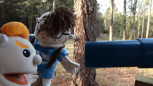 Two Stuffed Animals Looking Through Telescope