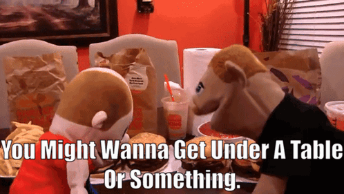 Two Stuffed Animals Saying You Might Wanna Get Under a Table