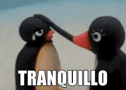 Two Stuffed Penguins Are Touching Each Other 'S Faces And The Words Tranquilo Are Written Above Them . GIF