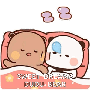 Two Teddy Bears Are Sleeping Next To Each Other In Bed . GIF